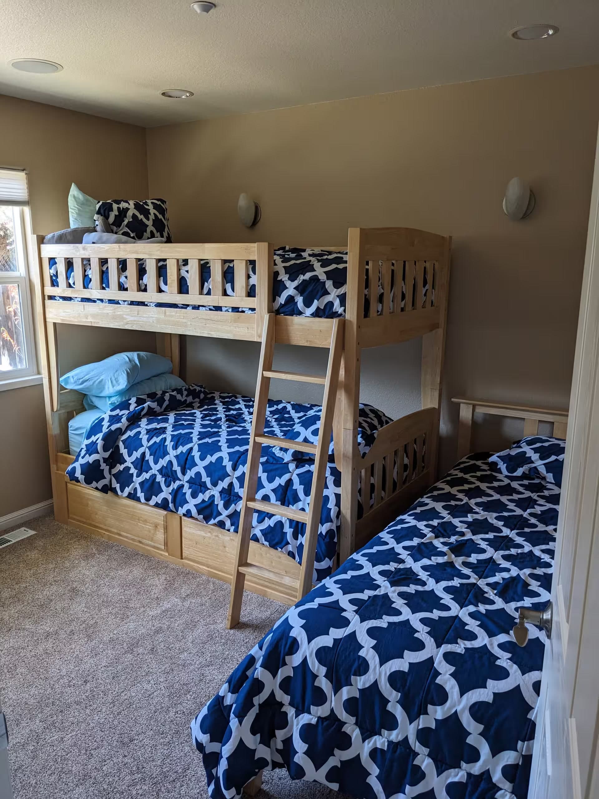 Kids’ bedroom with bunk beds and twin sleeping