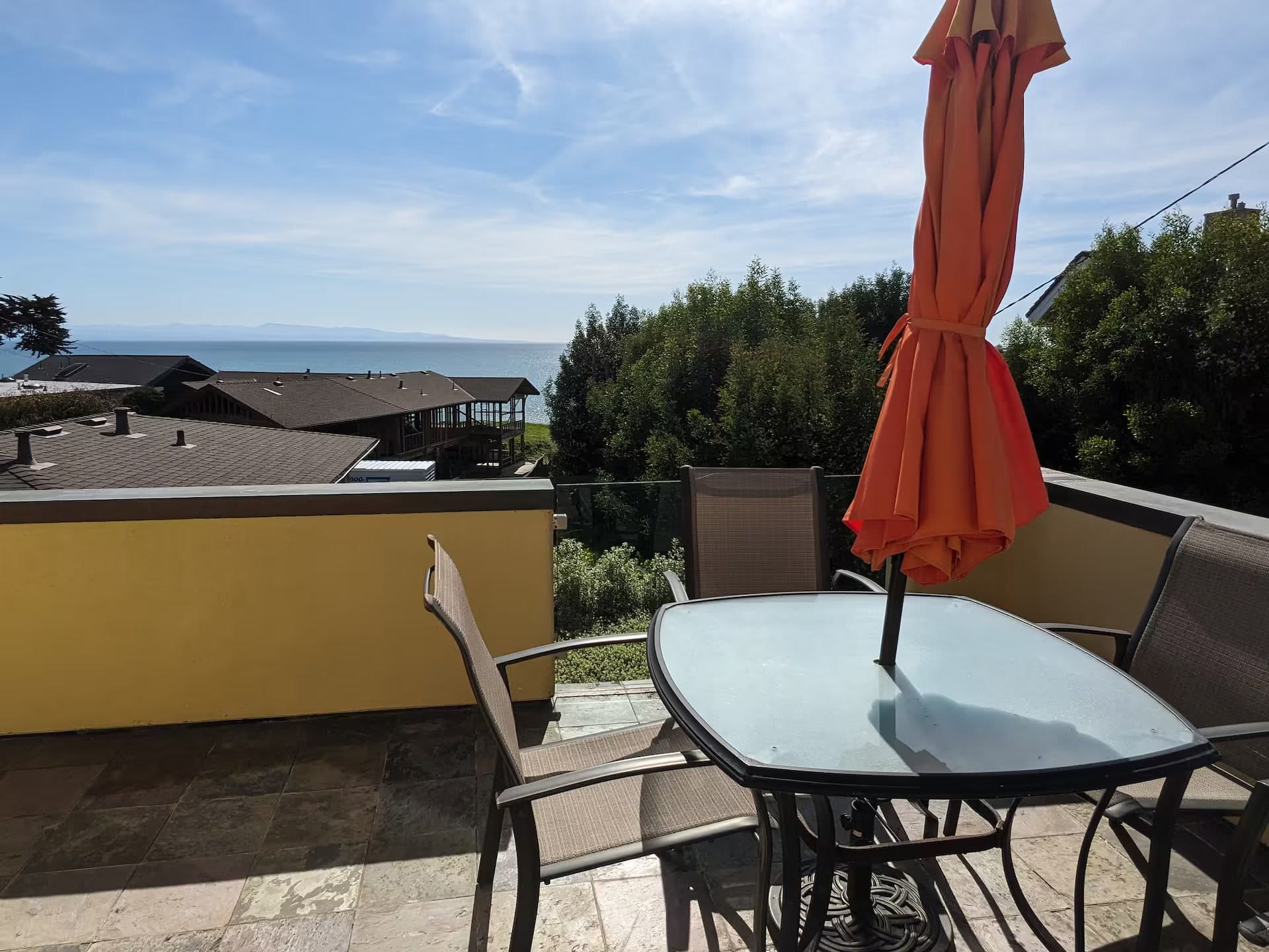 Upper balcony dining table with a panoramic ocean view